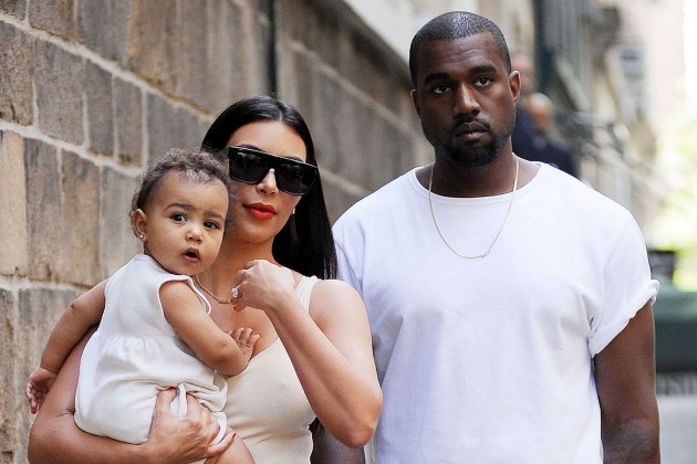 1418962482_kim_kardashian_and_kanye_west_with_daughter_north_west_80_2_2_w630